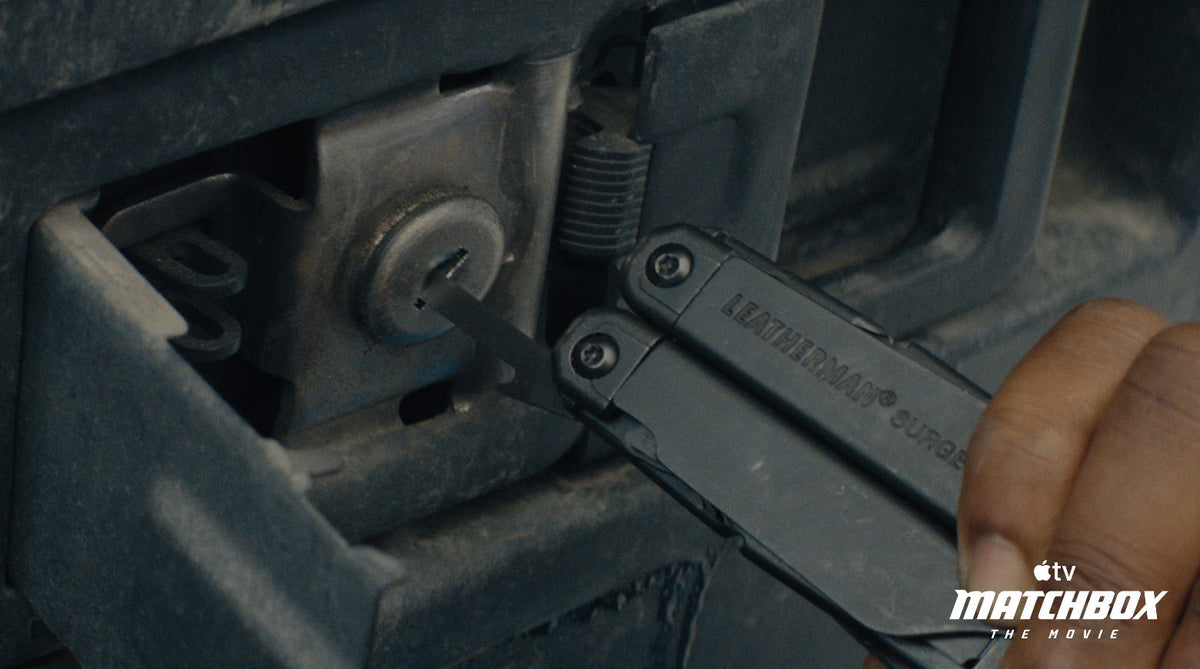 Translation missing: es.A close-up action shot of a person using a Leatherman Surge multi-tool in Apple TV Matchbox The Movie