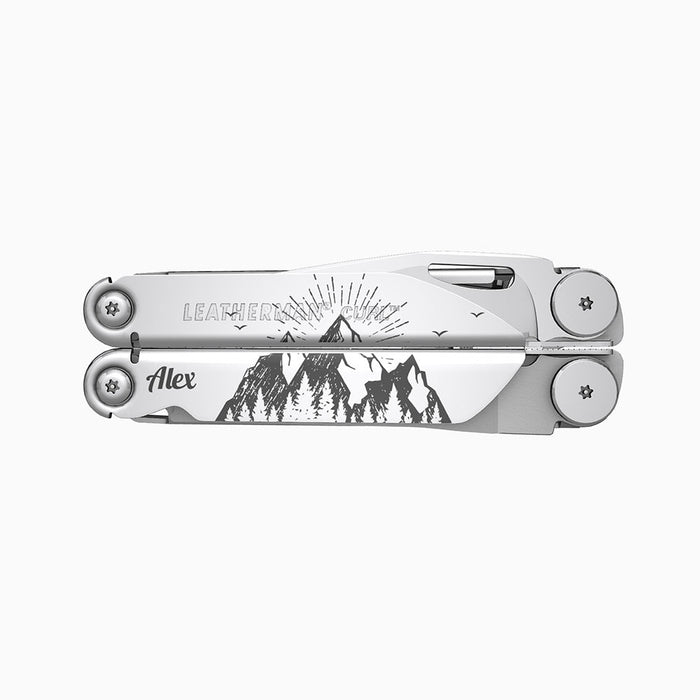 Translation missing: es.A stainless steel Leatherman Curl multitool featuring a detailed engraving of a mountain landscape with radiating lines suggesting a sunrise or sunset behind the mountains. The name “Alex” is engraved on one side