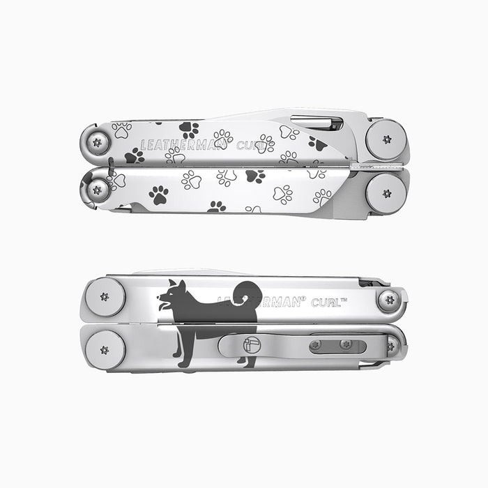 Translation missing: es.A stainless steel Leatherman Curl multitool engraved with playful pawprints and a silhouette of a dog. 