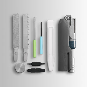 Translation missing: es.Batch #009: Adapter multitool components laid out, including files, saw, drivers, bits, and main tool body