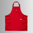 Translation missing: es.Red apron with neck strap, three front pockets, and long waist ties spread out flat