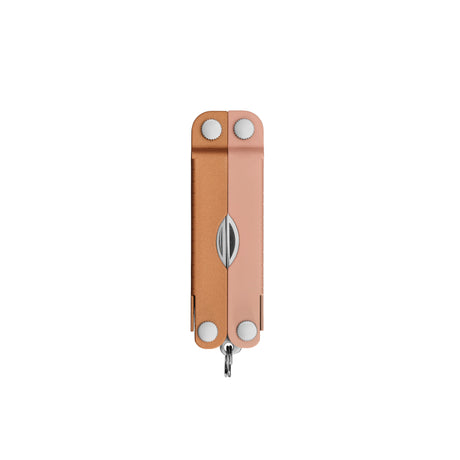 Translation missing: en.Closed Micra® multitool in Ginger Peach with visible hinge screws and small keychain loop