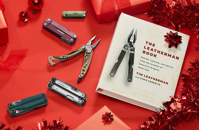 Translation missing: en.Colorful Leatherman multi-tools arranged around 'The Leatherman Book' on a festive red background