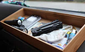 Translation missing: en.2 black flashlights, lined notebook, blue lighter, junk mail in wooden drawer